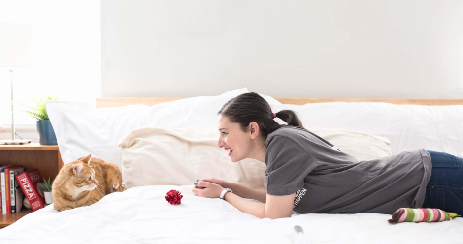 woman and cat laying on a bed, pet care franchise company, pet care company, franchise consultant, franchise coach, Scott Milas franchise coach